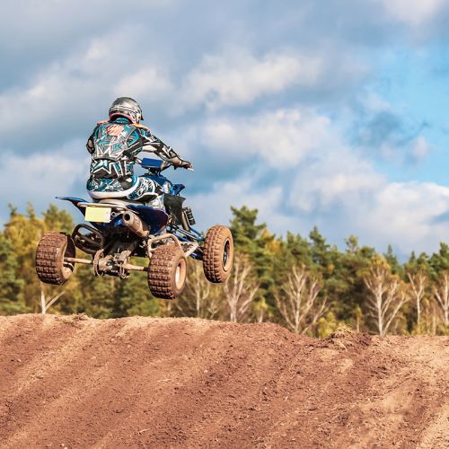 Motocross competition, the man jumps on quad bike, extremal kind of sports